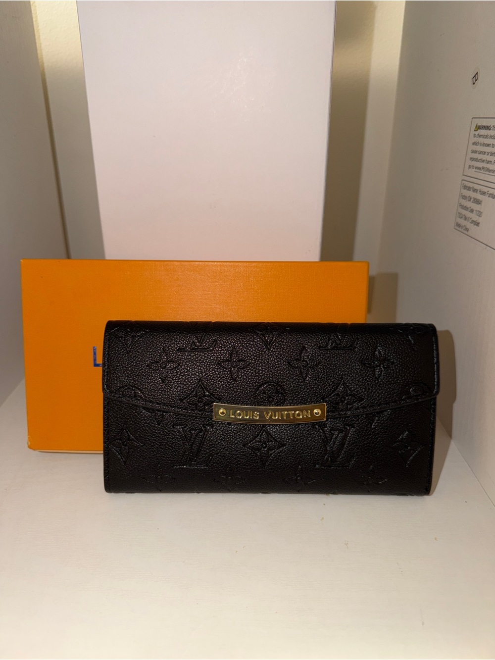 Black Embossed Continental Wallet